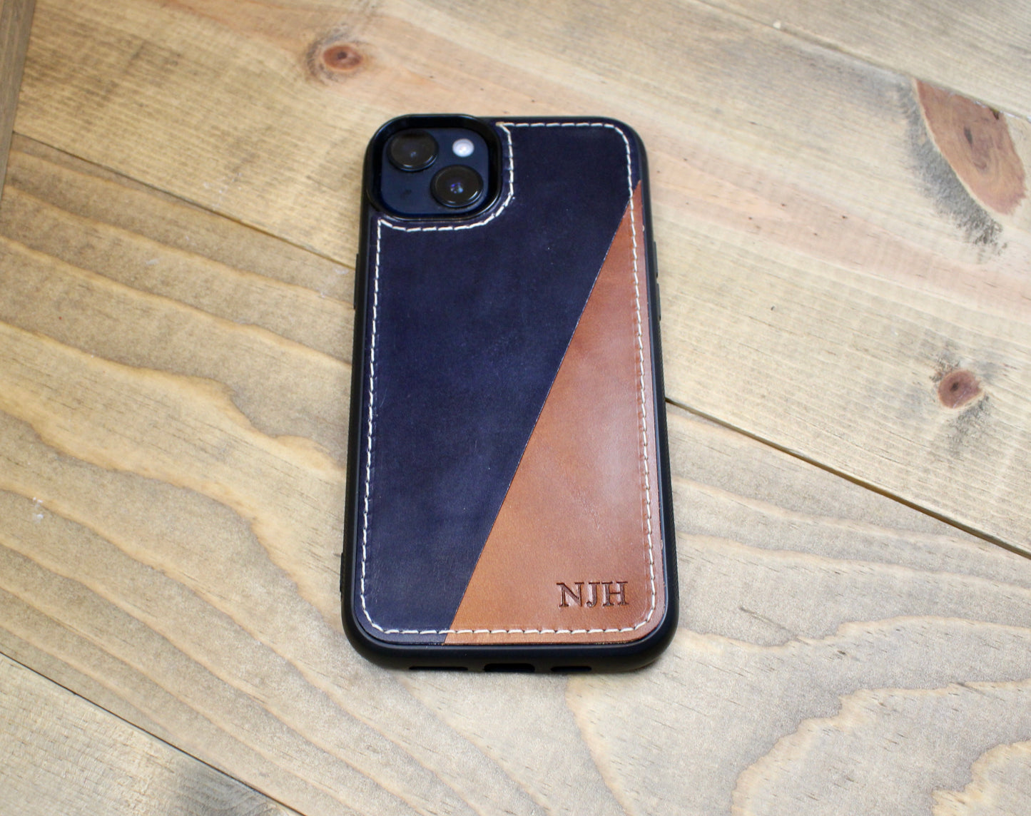 Buck Brown and navy blue Premium leather iPhone case with a sleek design, durable protection, and a soft, handcrafted finish for a stylish and sophisticated look.
