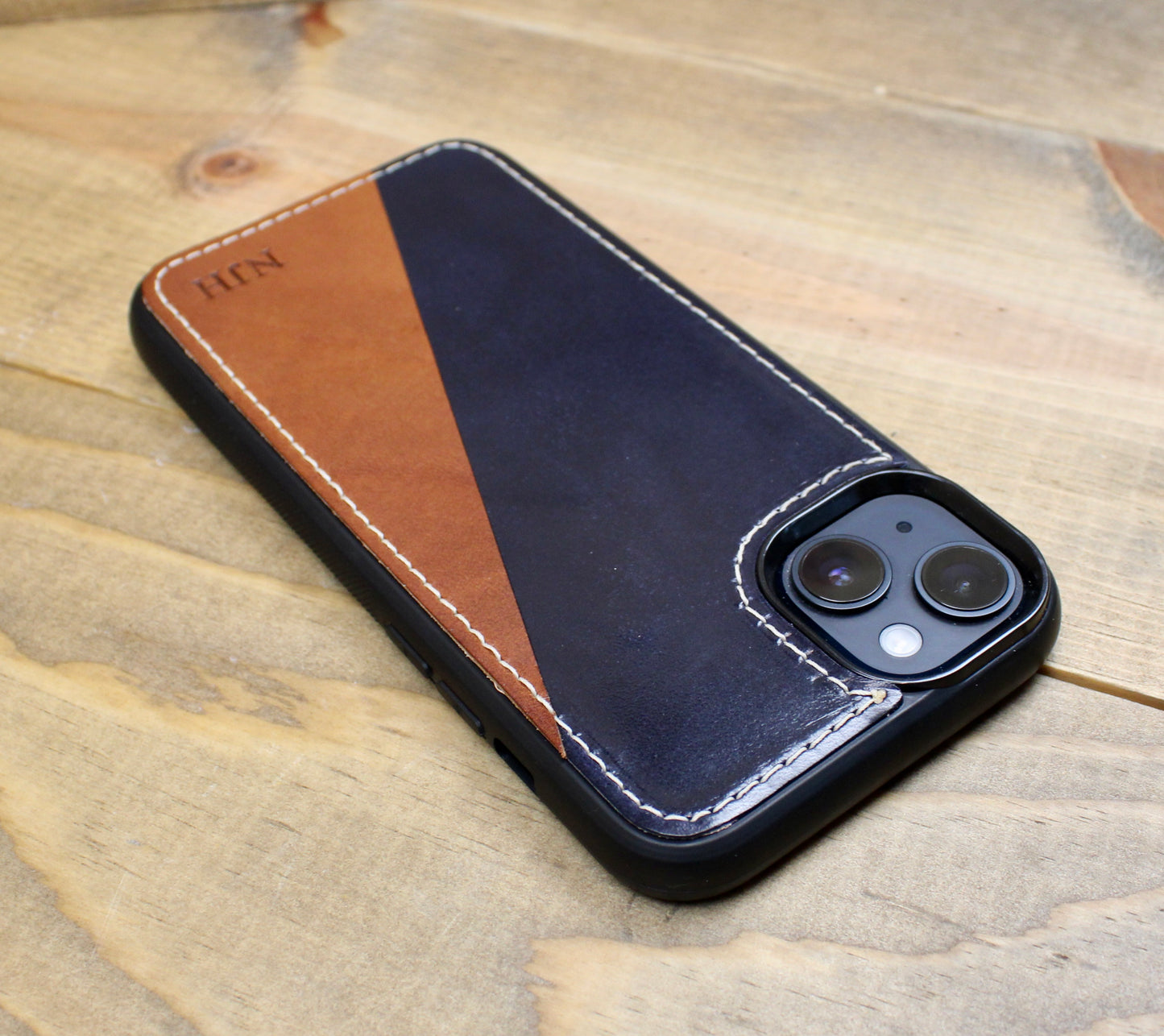 Buck Brown and navy blue Premium leather iPhone case with a sleek design, durable protection, and a soft, handcrafted finish for a stylish and sophisticated look.
