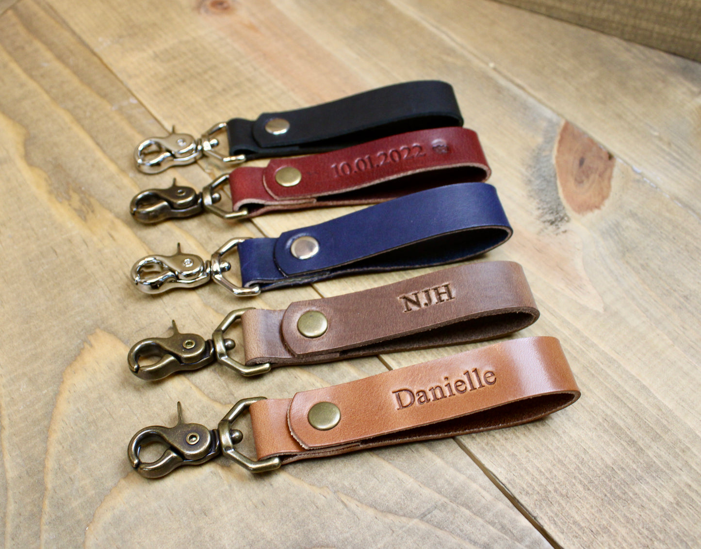 Handcrafted leather keychain with a secure snap button closure, stylish design, and durable construction for everyday use.