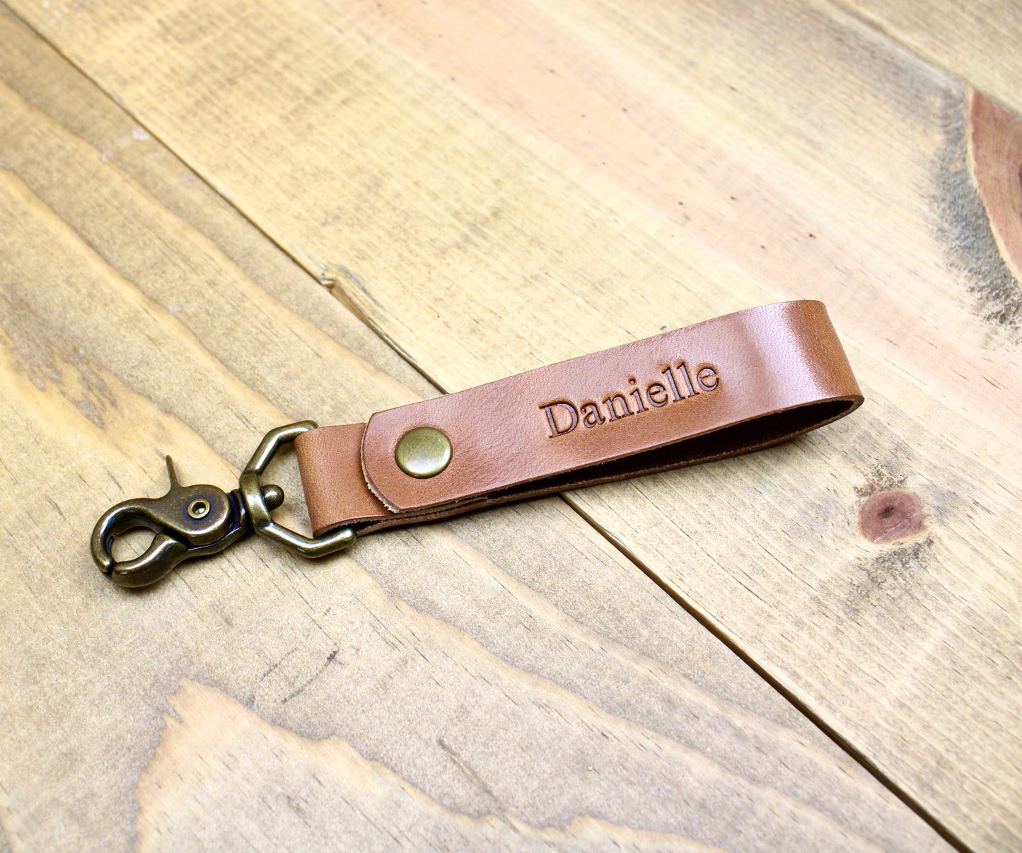 Buck Brown Premium leather keychain with a snap button closure, combining durability and elegance for a sleek, functional accessory.