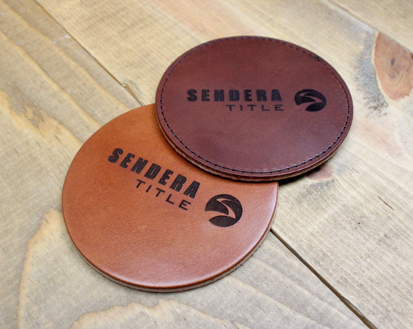Customized leather coasters featuring intricate laser engraving and premium craftsmanship, perfect for adding a personalized touch to any tabletop.