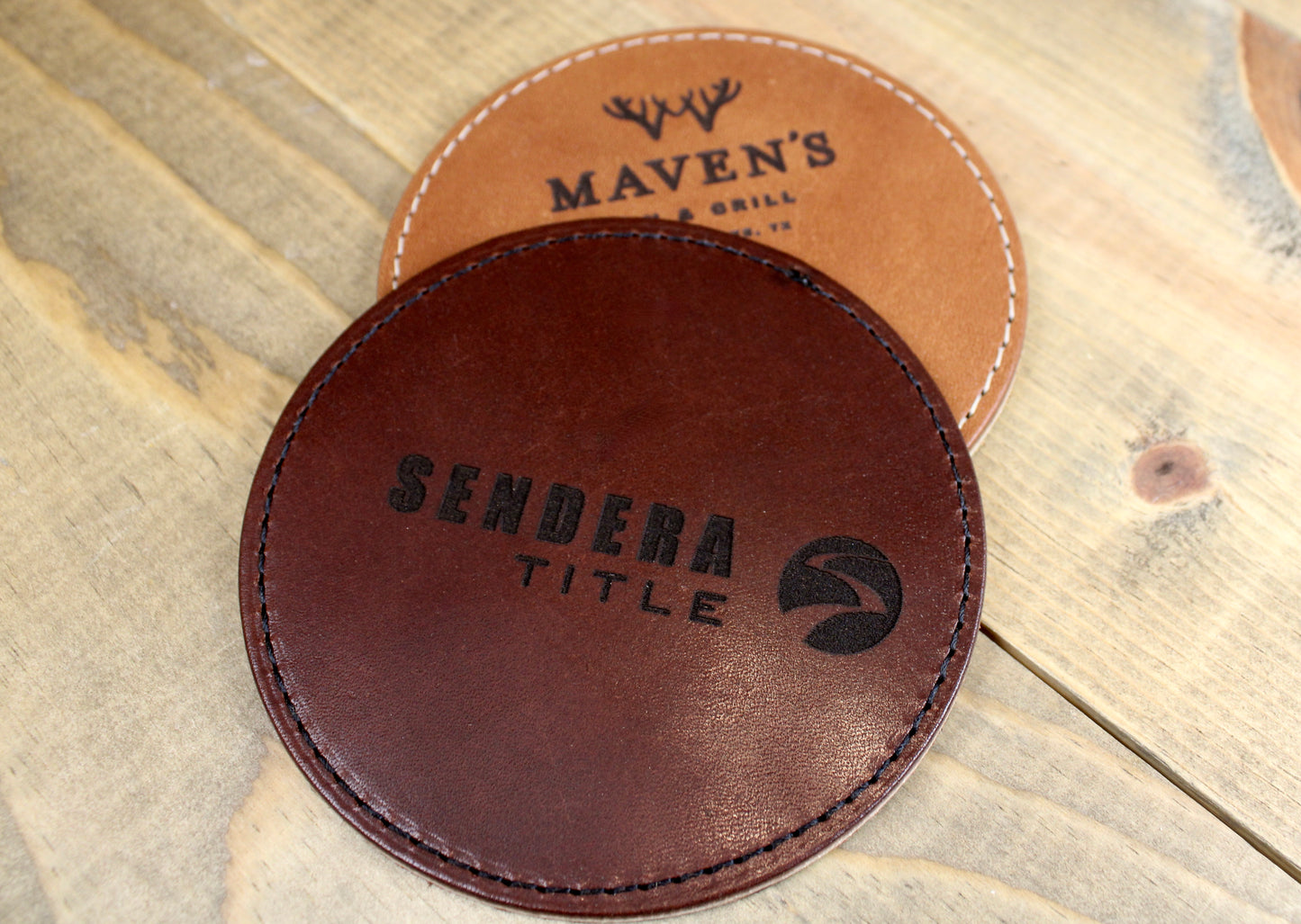 Customized leather coasters featuring intricate laser engraving and premium craftsmanship, perfect for adding a personalized touch to any tabletop."