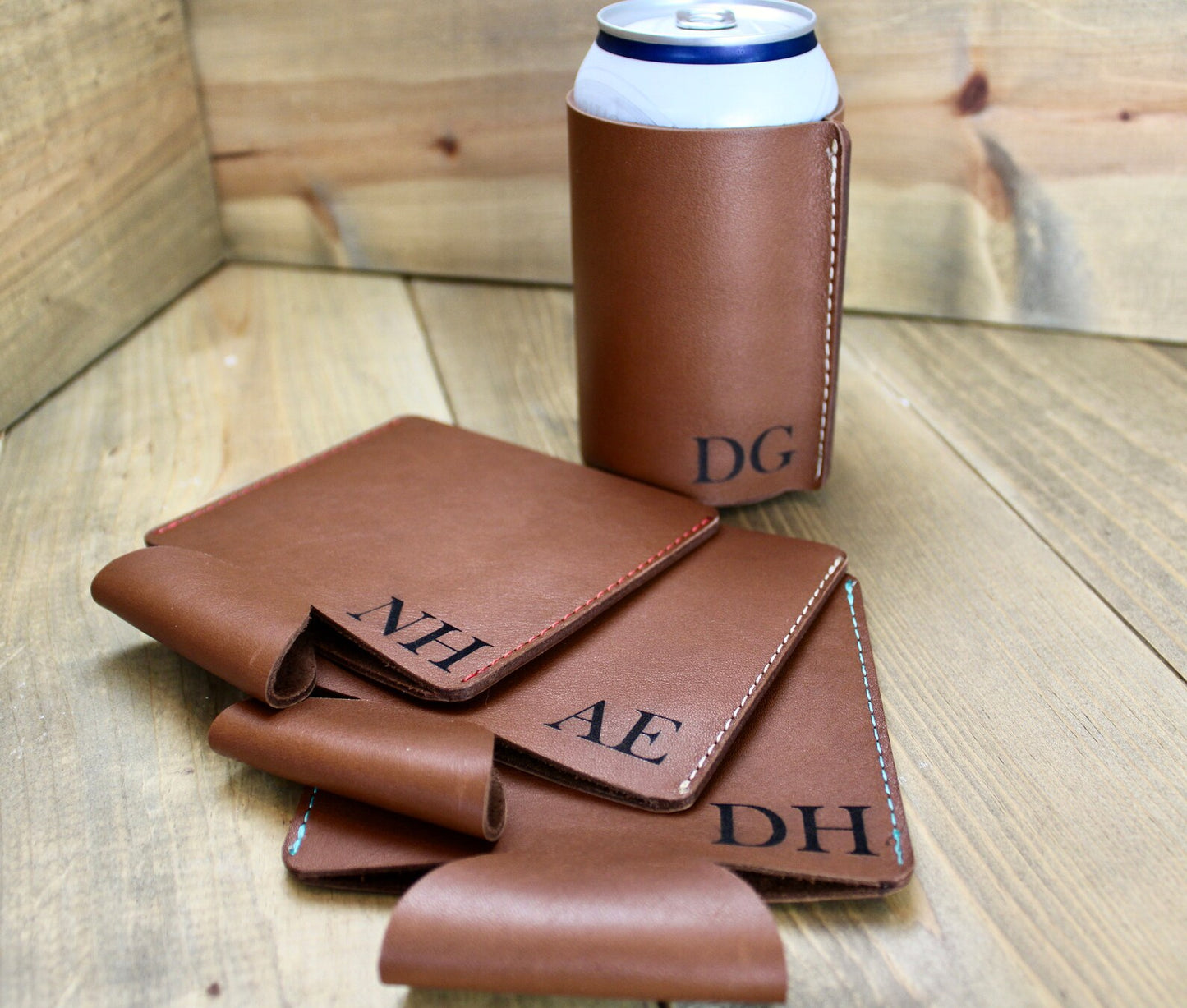 Brown personalized leather can coolers with custom engraving, featuring a stylish and durable design to keep drinks cold in style.