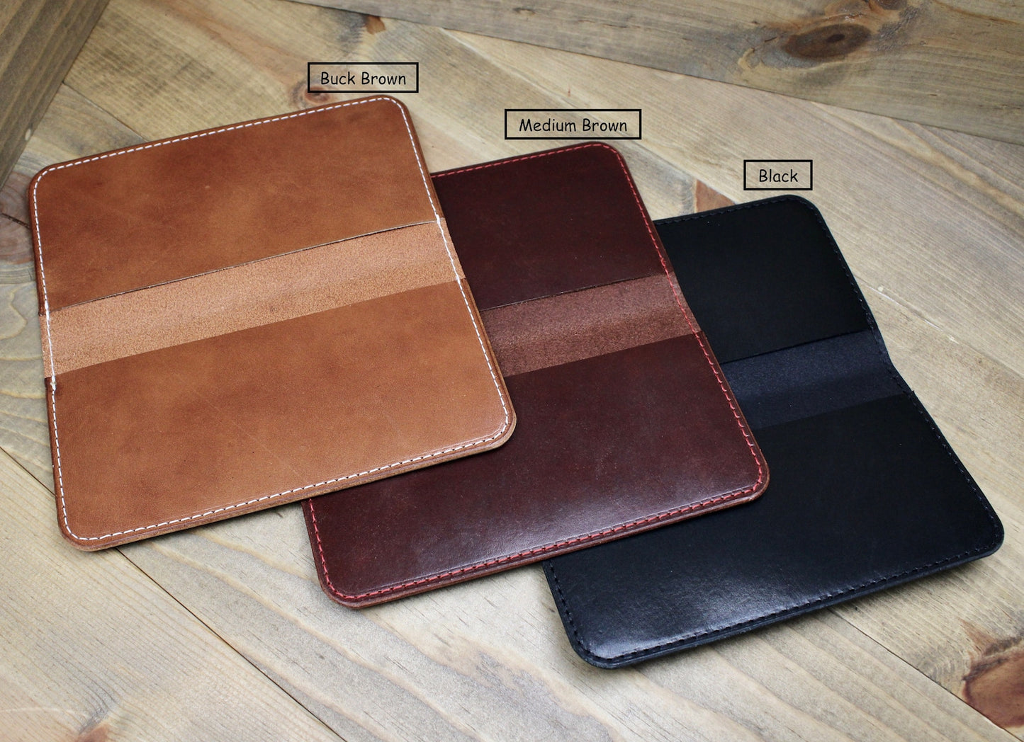 Elegant black leather checkbook holder with a sleek design, durable stitching, and spacious compartments for checks, cards, and essentials.
