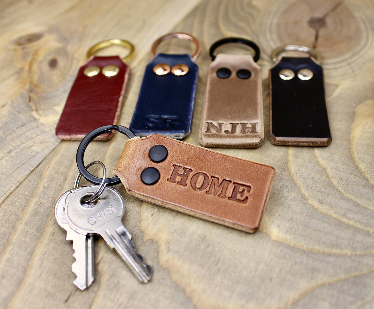 HOME Stamped on a Buck Brown Leather Keychain with Black Rivets and Black Keyring