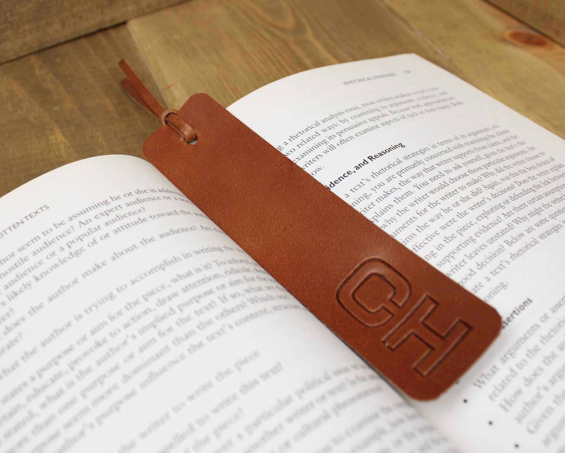 Handcrafted leather bookmark with a sleek design and durable finish, adding a touch of elegance to your reading experience.