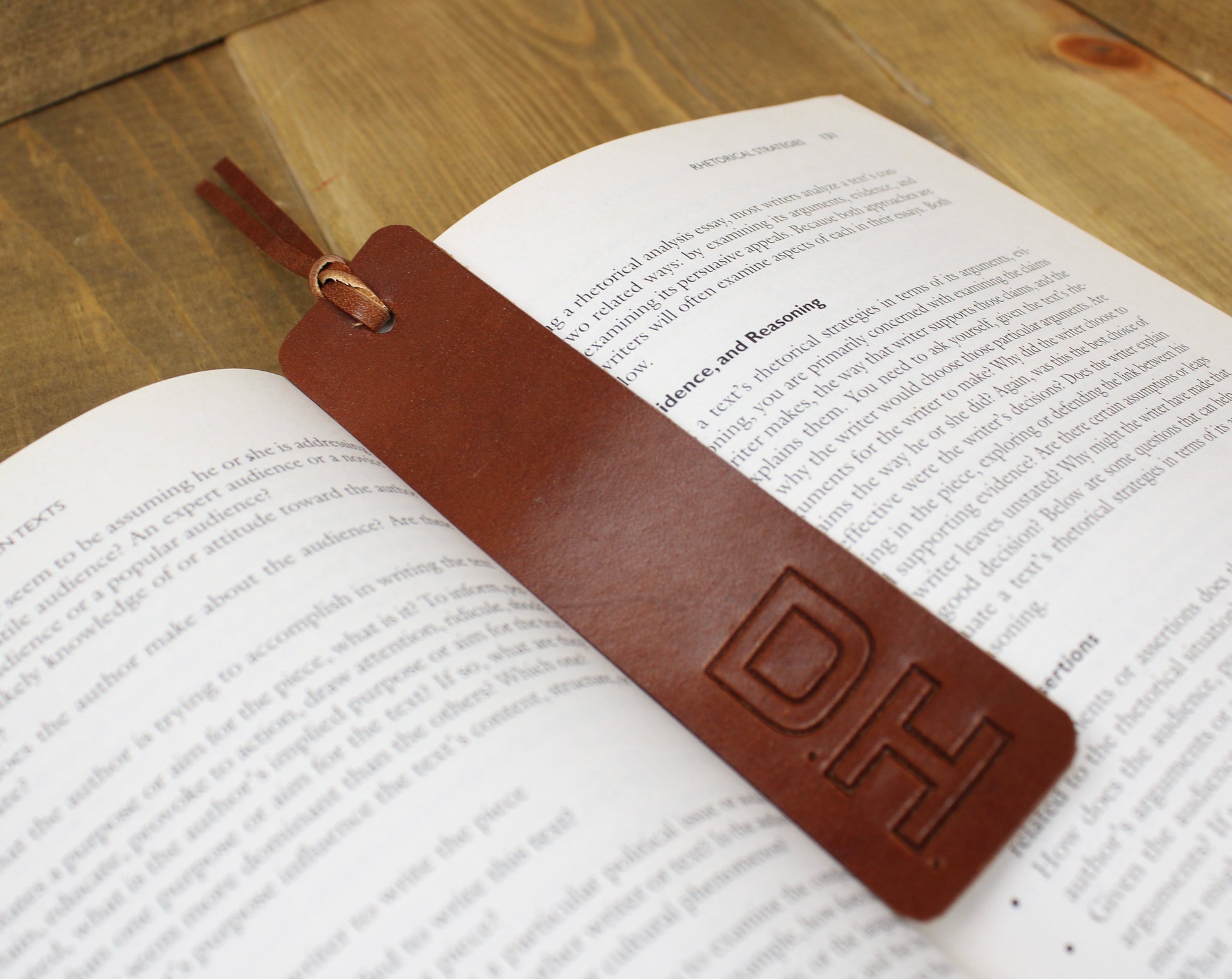 Handcrafted leather bookmark with a sleek design and durable finish, adding a touch of elegance to your reading experience.