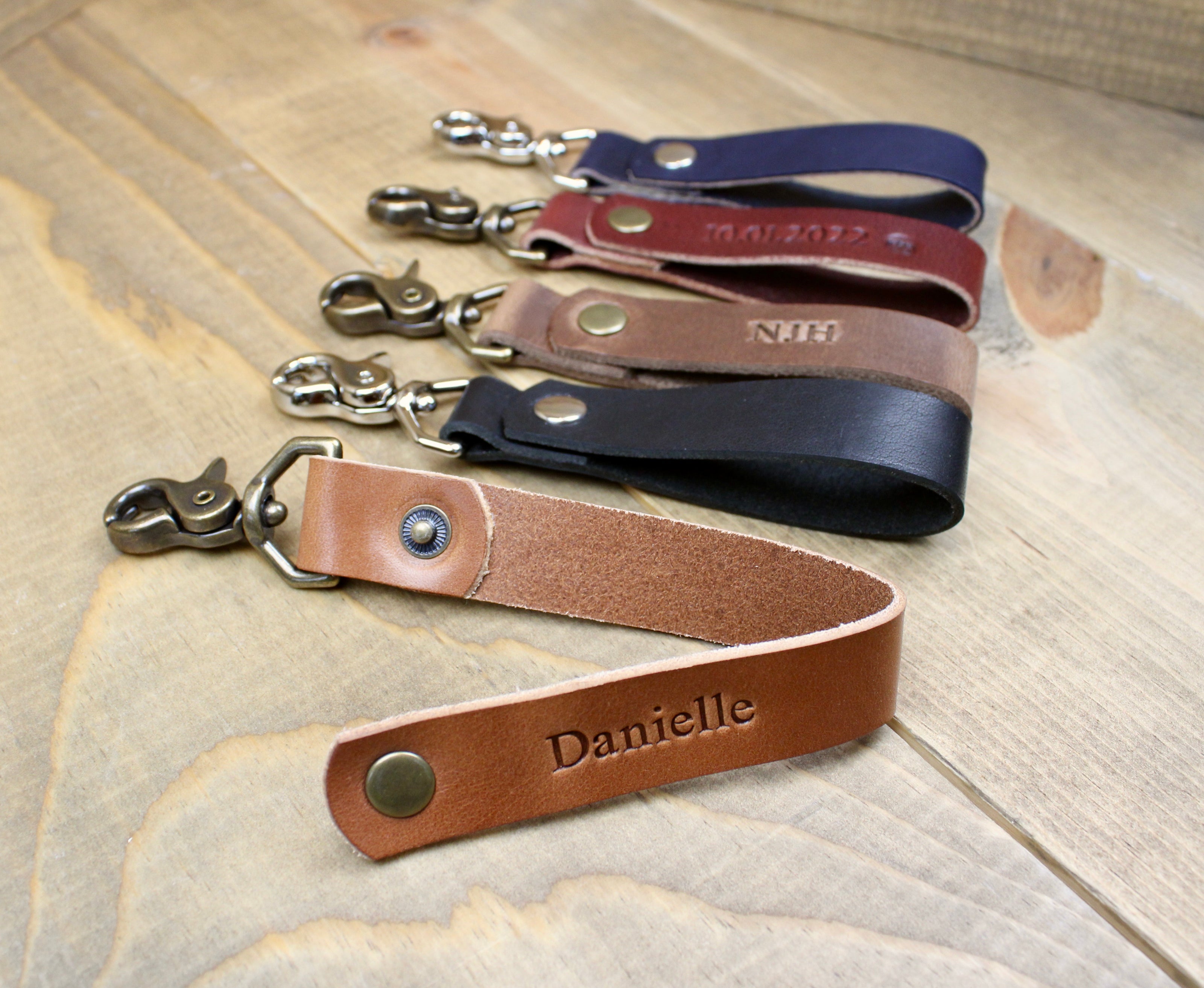 Handmade leather keychain with snap button. Choose between Buck Brown, Brown, Black, Navy Blue, Burgundy, or Navy blue leather with either Silver or Antique Brass hardware. 